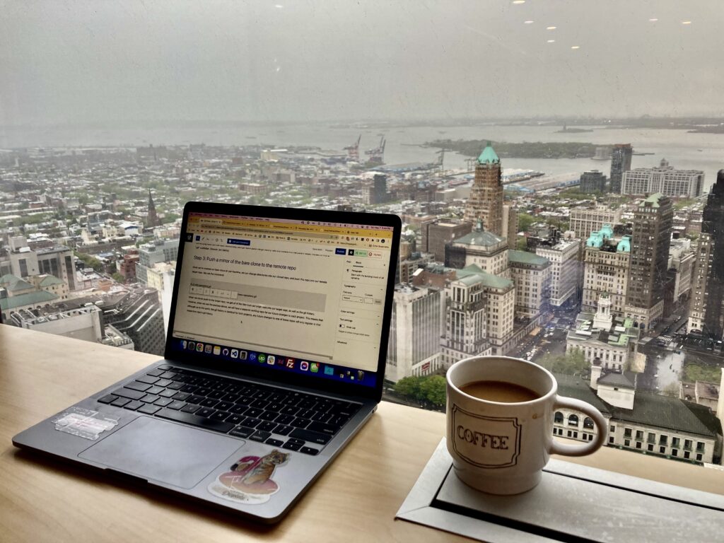 Laptop and desk on top floor of New York apartment building office